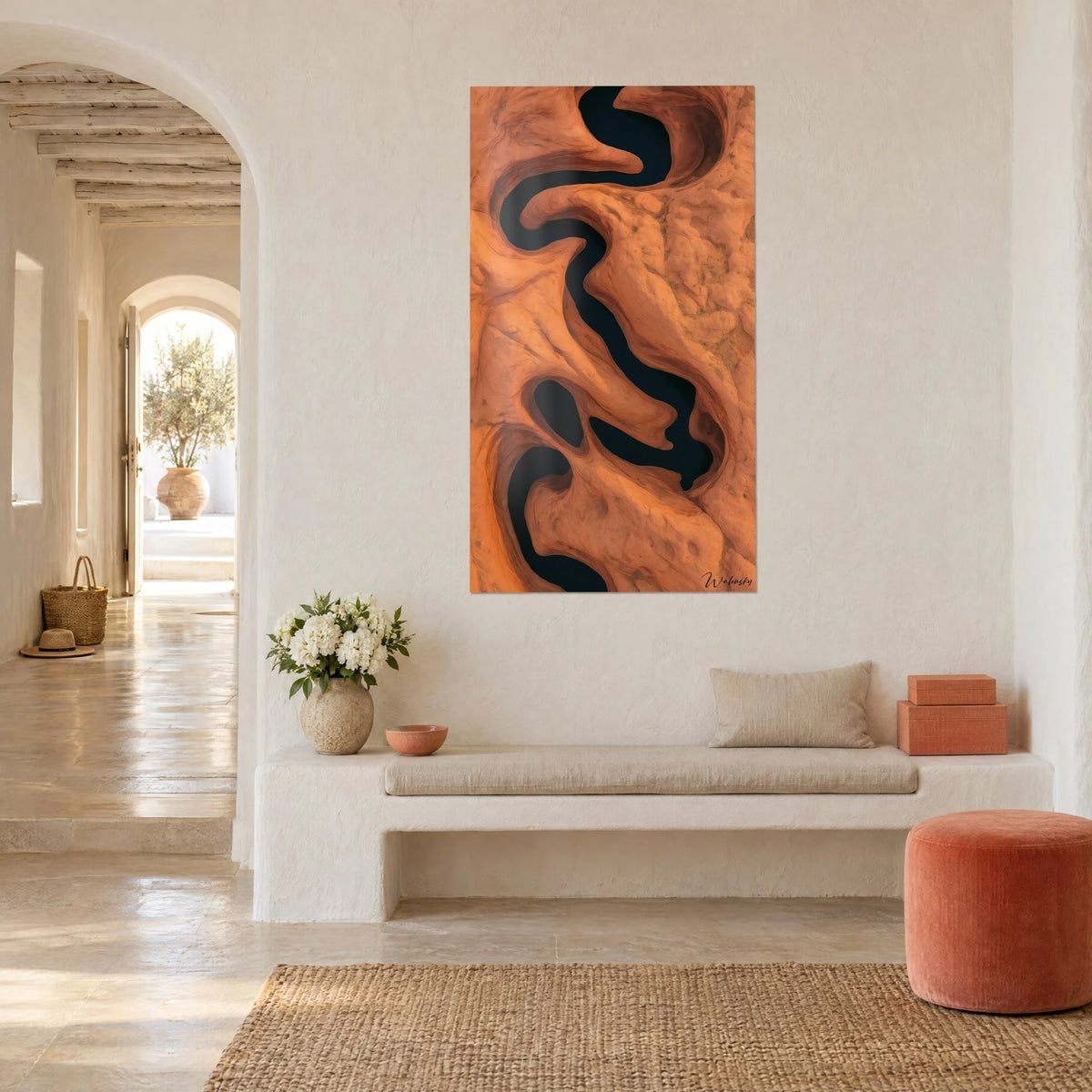 Wall art of a black ink meander between terracotta cliffs, aerial view, on a white wall of a Greek house