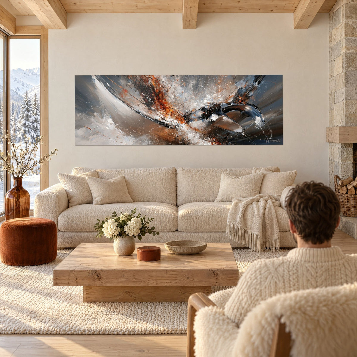 Wall art manta ray with orange and white splashes, steel grey background, above a sofa in a bright living room