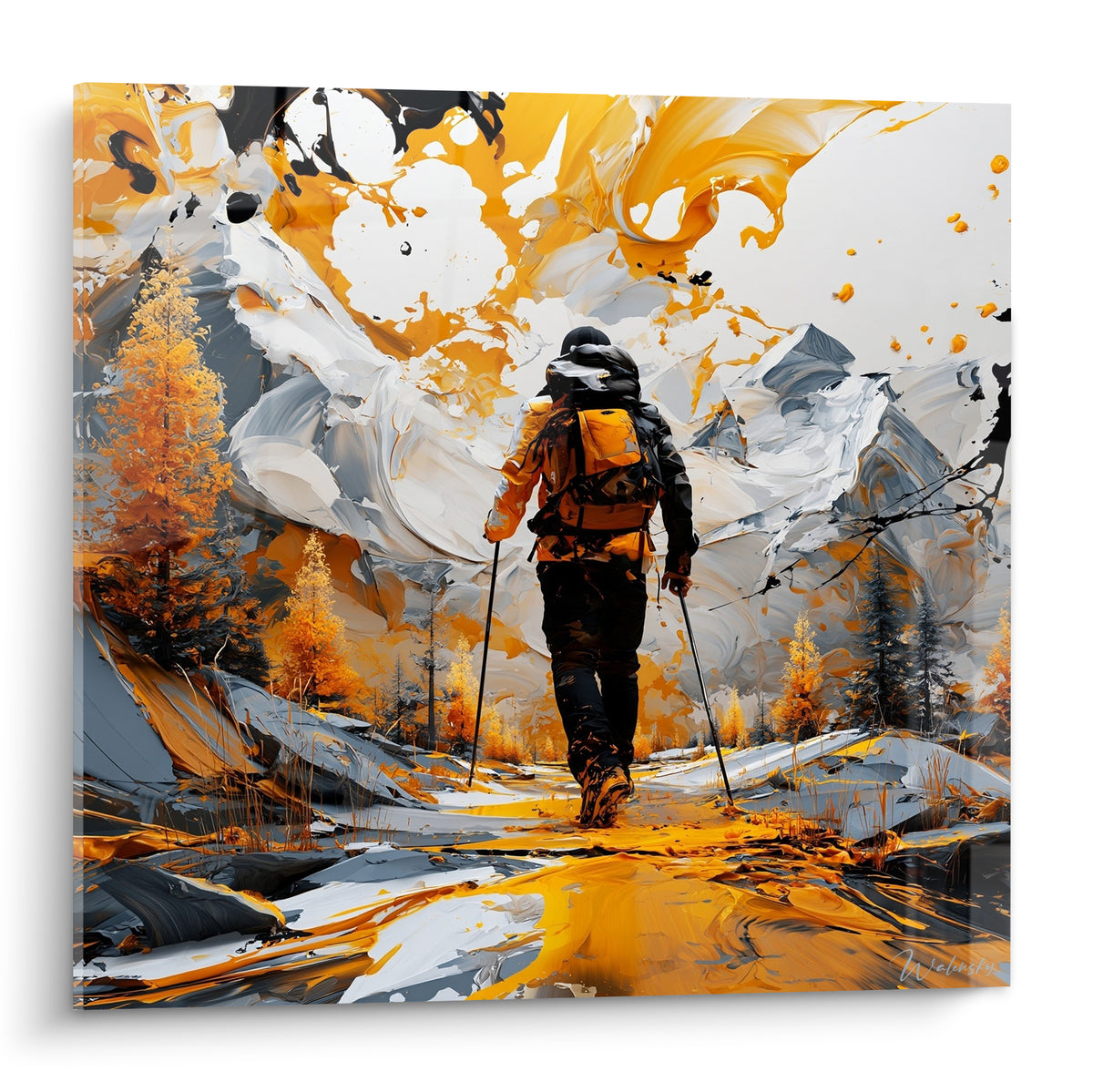 Randonneur en noir et orange traversant un décor de montagne ocre et blanc éclaboussé