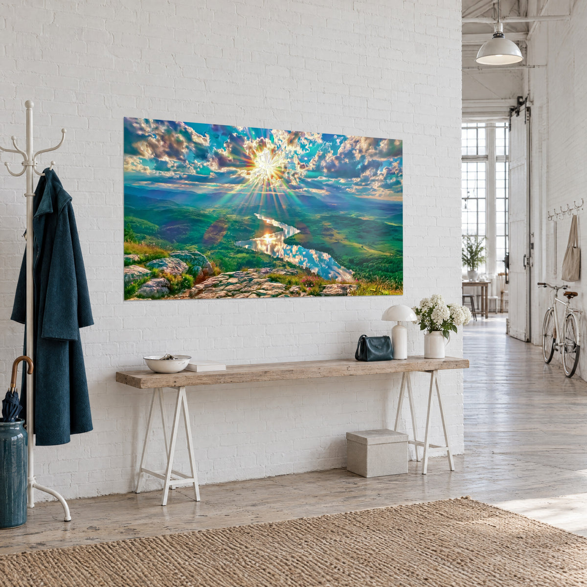 Wall art mountain panorama under a turquoise and golden sky, sunbeams over the valley, hung above a wooden console