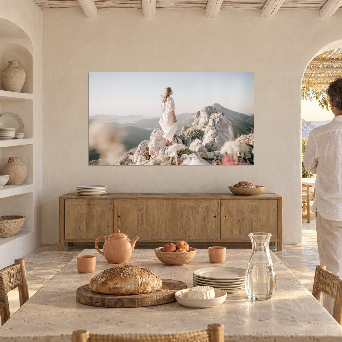 Wall art young woman with golden hair blowing in the wind on a limestone peak, beige and pink sky, arched dining room with white walls