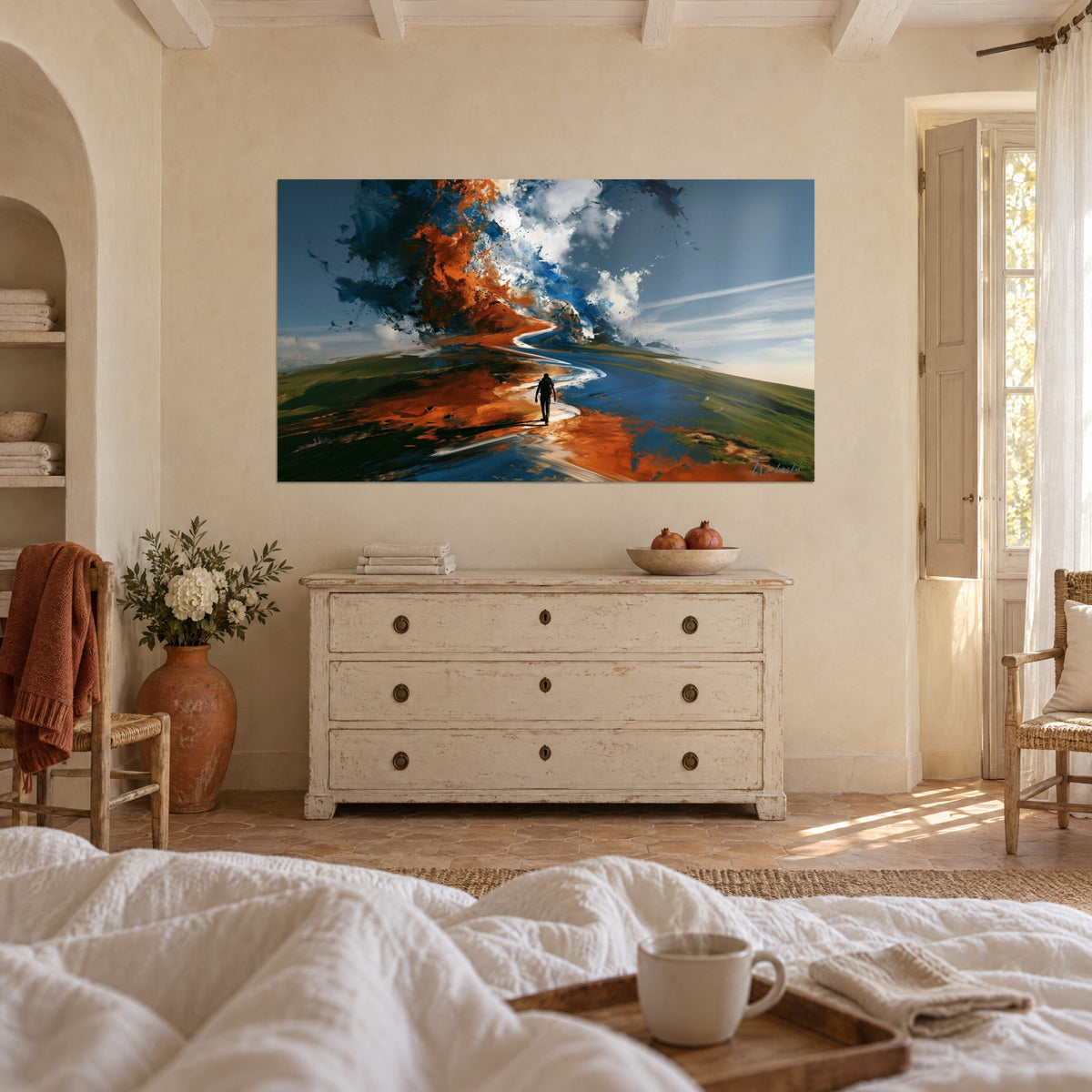 Wall art of a stroller on an orange and blue ribbon winding through green grass, white clouds, couple seen from behind above a bed in a bright bedroom