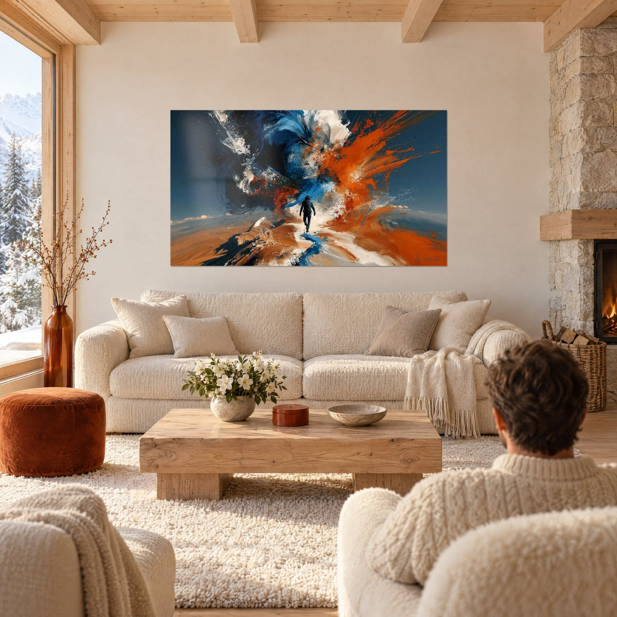 Gemälde Wanderer in schwarzer Jacke, unterwegs auf eine blau-orange Farbwolke zu, über einem Sofa in einem hellen Wohnzimmer