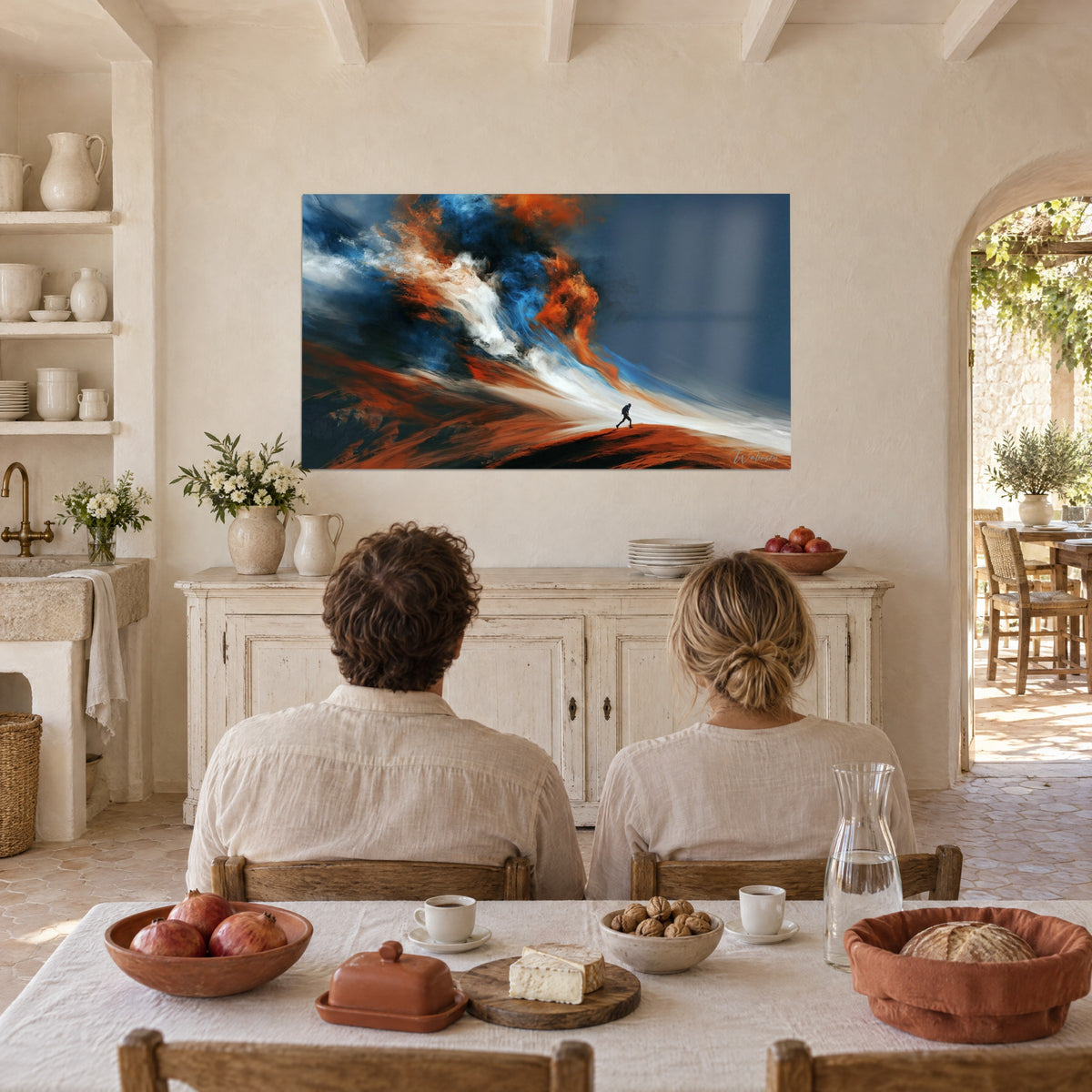 Wall art tiny walker beneath a storm of cobalt blue and burnt orange paint, couple seen from behind seated at a table in the farmhouse