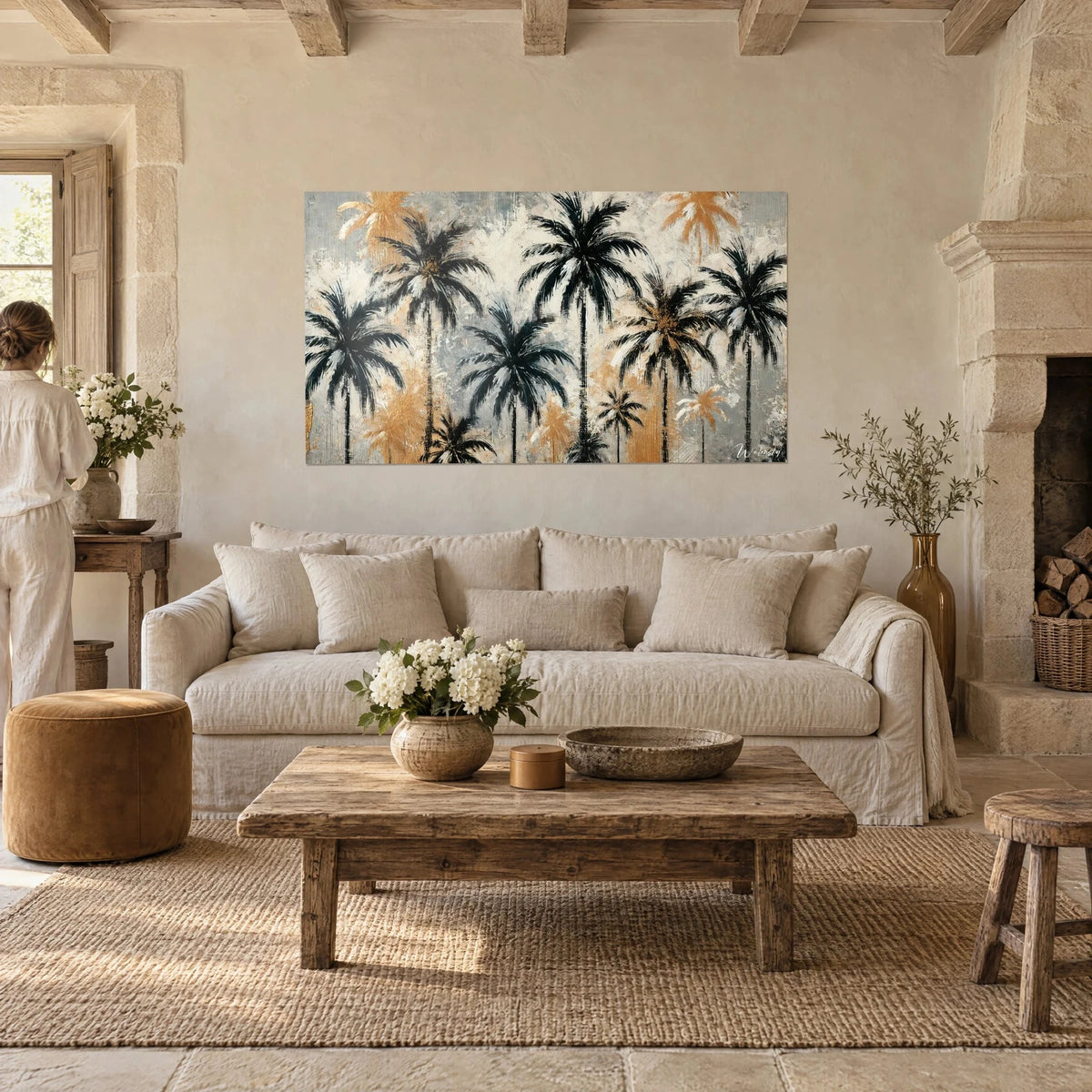 Wall art black palm trees with brushstroke fronds, cream and gold background, above a sofa in a bright living room