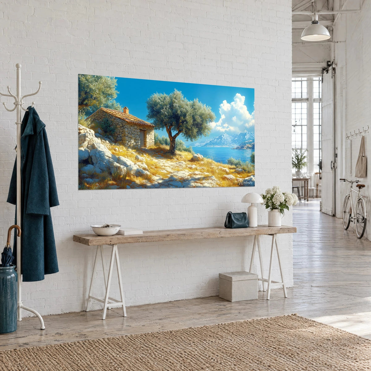 Wall art of a sheepfold with orange-tiled roof beside an olive tree, white cliffs and azure cove, three-quarter view in a loft