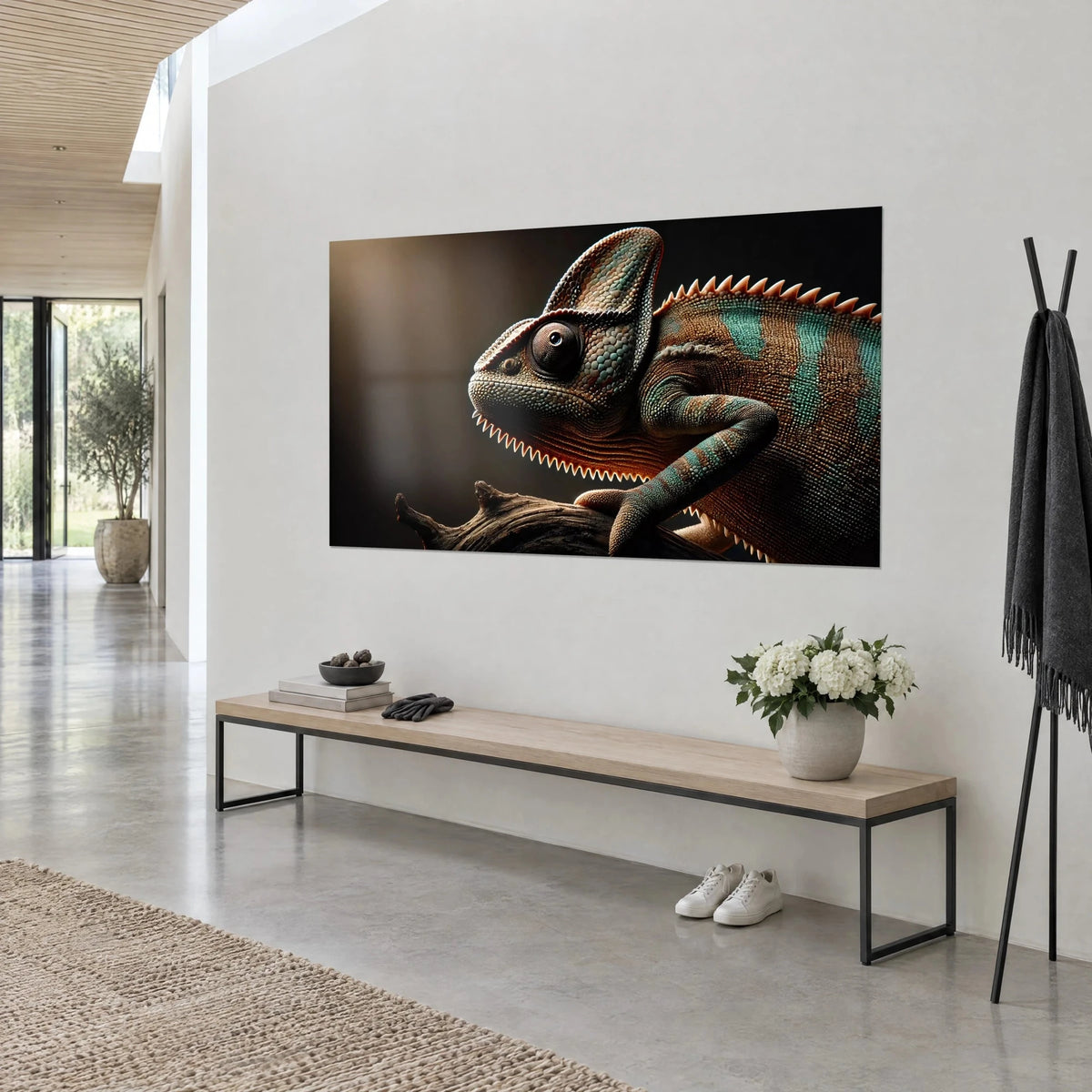 Wall art of a crested reptile with a bronze and verdigris serrated crest on a dark brown background, white wall and wooden bench, three-quarter view