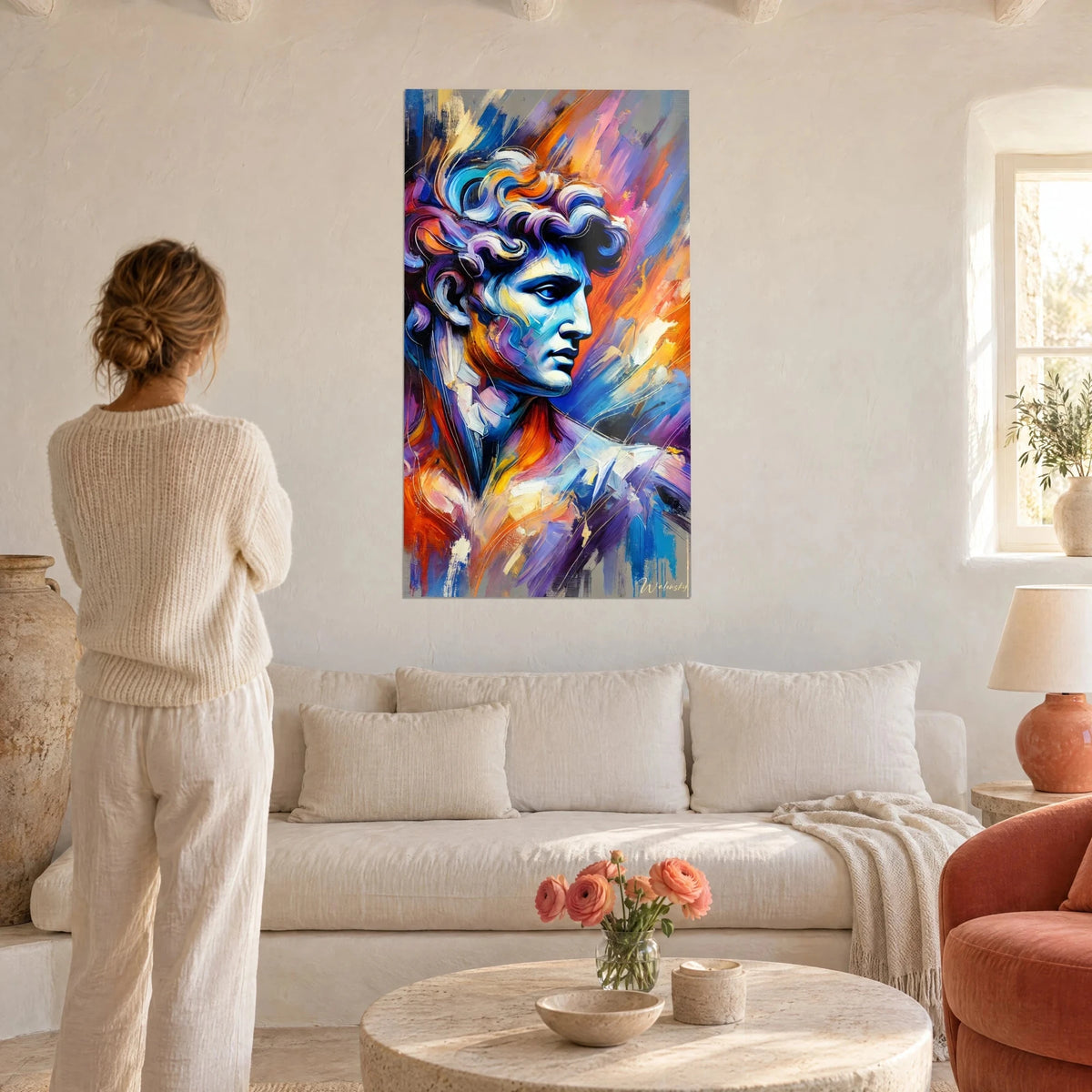 Wall art antique statue bust in cobalt blue and vivid orange, background of violet brushstrokes, above a sofa in a bright living room