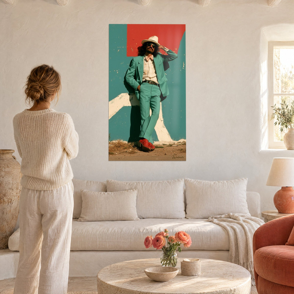 Wall art of a dandy in a mint suit leaning against a red and turquoise wall, cream hat, above a sofa in a bright living room