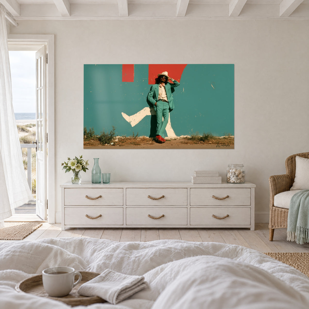 Cuadro de un elegante barbudo con gafas oscuras, chaqueta menta y botines rojos, pared turquesa, sobre una cama en un dormitorio luminoso