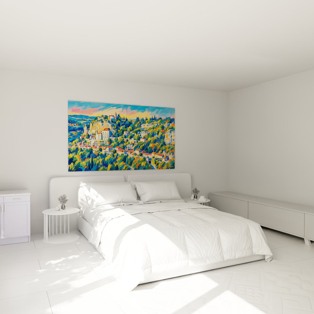 Wall art village perched on ochre cliff, orange rooftops and blue-green forest under a pink sky, above a sofa in a bright living room