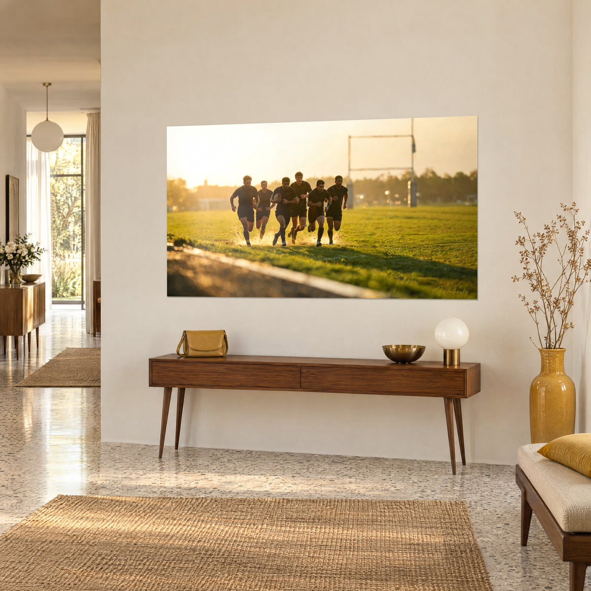 Wall art rugby team in full sprint, flying earth, emerald grass and amber sky, three-quarter view above a wooden sideboard