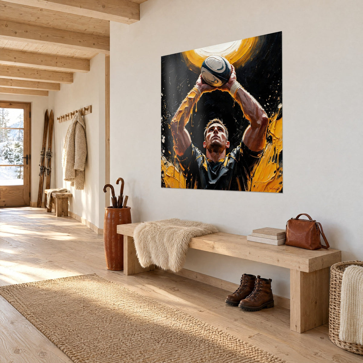 Quadro rugbista con le braccia alzate che tiene un pallone ovale, sfondo nero e alone giallo senape, appeso nell'ingresso di uno chalet in legno chiaro