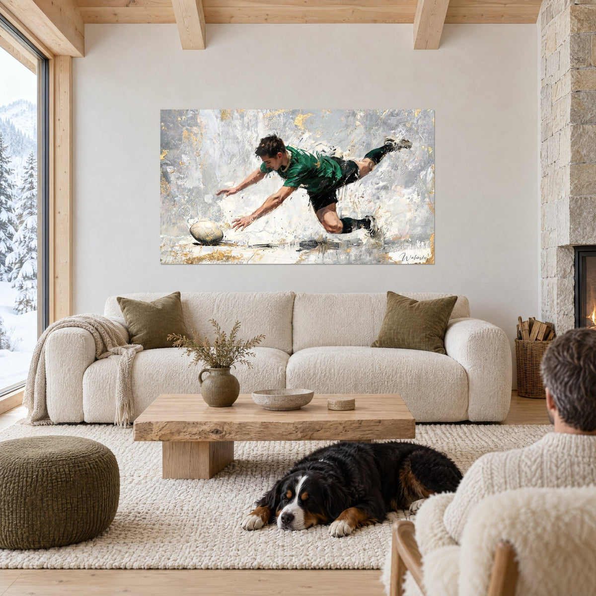 Wall art rugby player in a green jersey diving toward an ivory ball, gold highlights on grey background, above a sofa in a bright living room