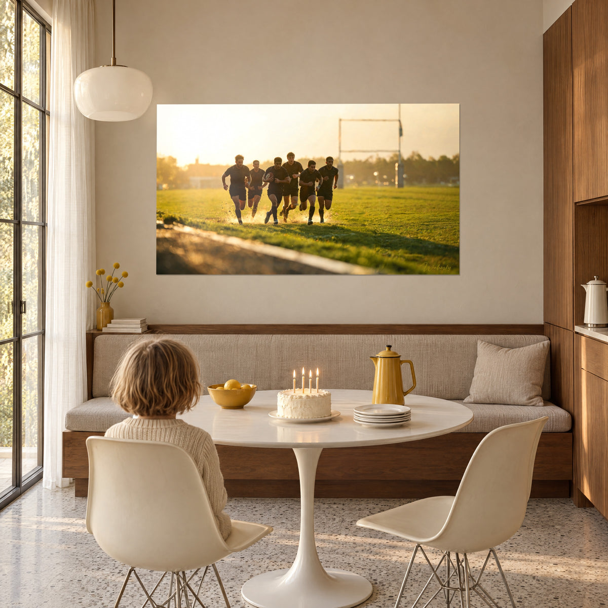Wall art collective rugby sprint in black kit, green grass and golden mist, hung in a dining corner beside a round white table
