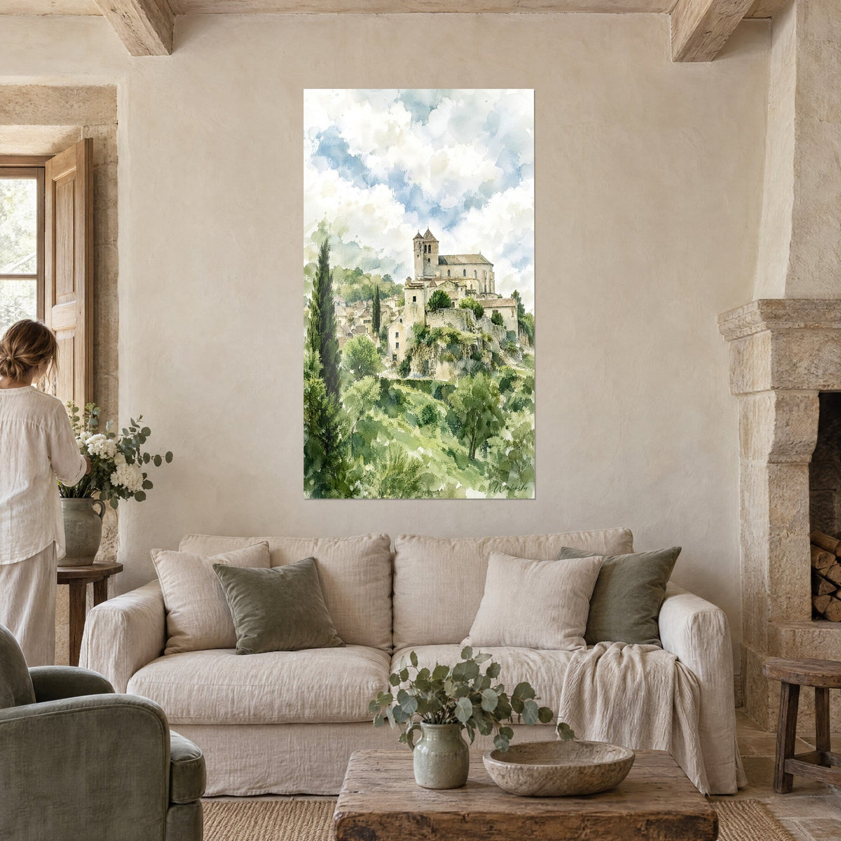 Wall art Medieval village perched on its rock, beige rooftops and green cypress trees, watercolour, above a sofa in a bright living room