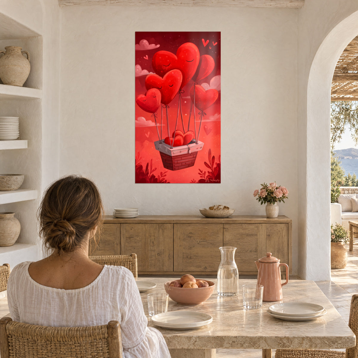 Cuadro corazones gigantes rojo vivo suspendidos con cintas de una cesta blanca y marrón, cielo coral, frente a una mesa de comedor