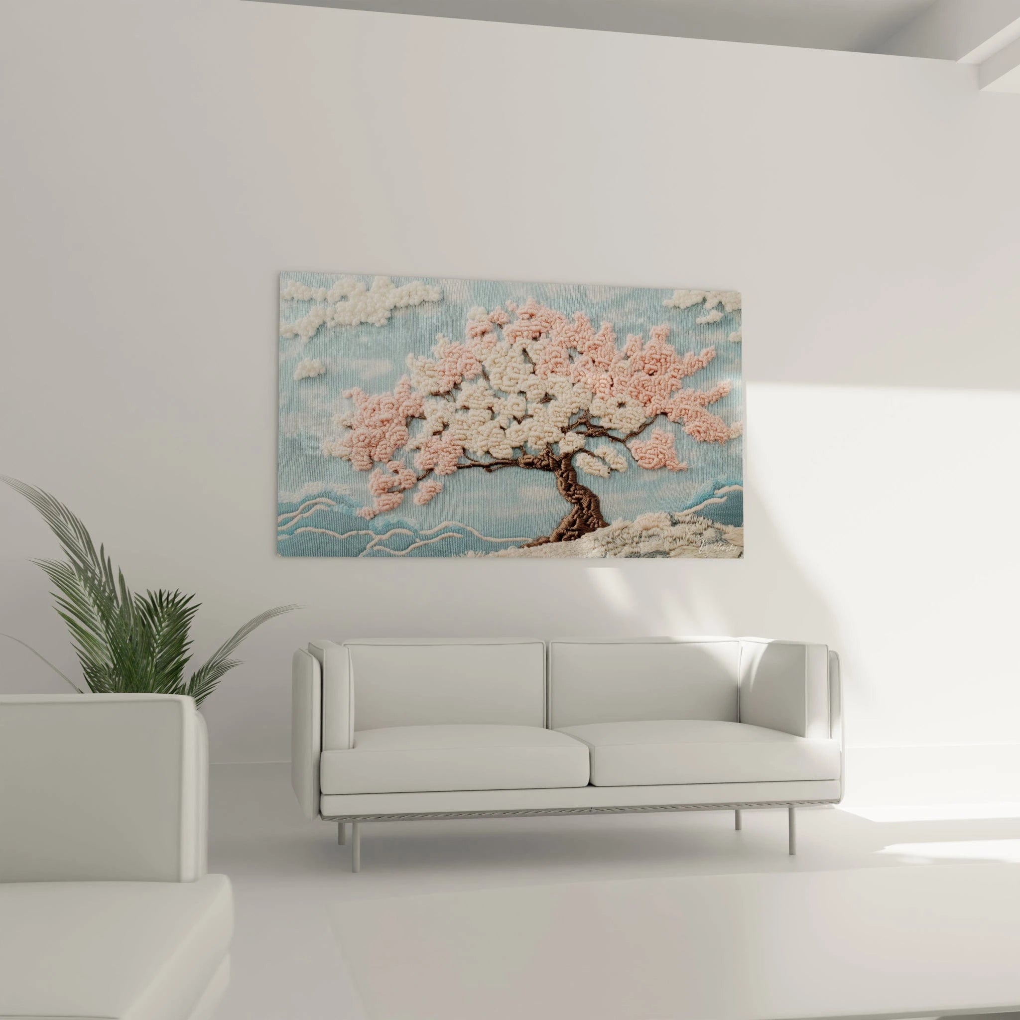 Un tableau brodé en relief présentant un cerisier en fleurs avec des pétales roses et blancs finement travaillés, dont les branches s'étendent sur un fond bleu ciel, complété par des nuages texturés blancs et des vagues stylisées au bas, montrant un savoir-faire artisanal de crochet exceptionnel.
