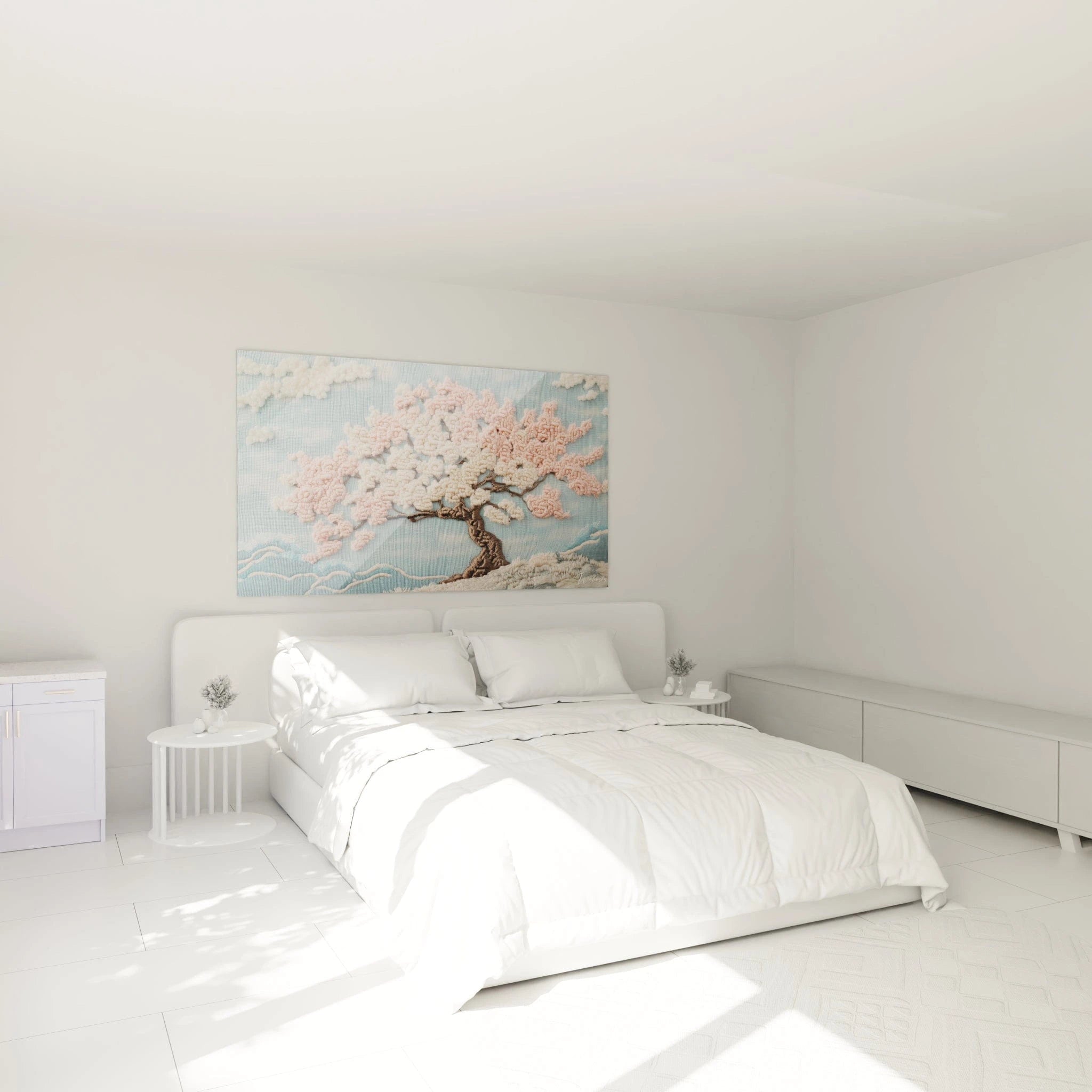 Un tableau cerisier japonais en technique crochet montrant un arbre aux fleurs roses et blanches délicatement brodées en relief, avec un tronc brun texturé, des nuages duveteux et des vagues stylisées bleues, le tout sur un fond textile bleu ciel créant une atmosphère printanière apaisante.
