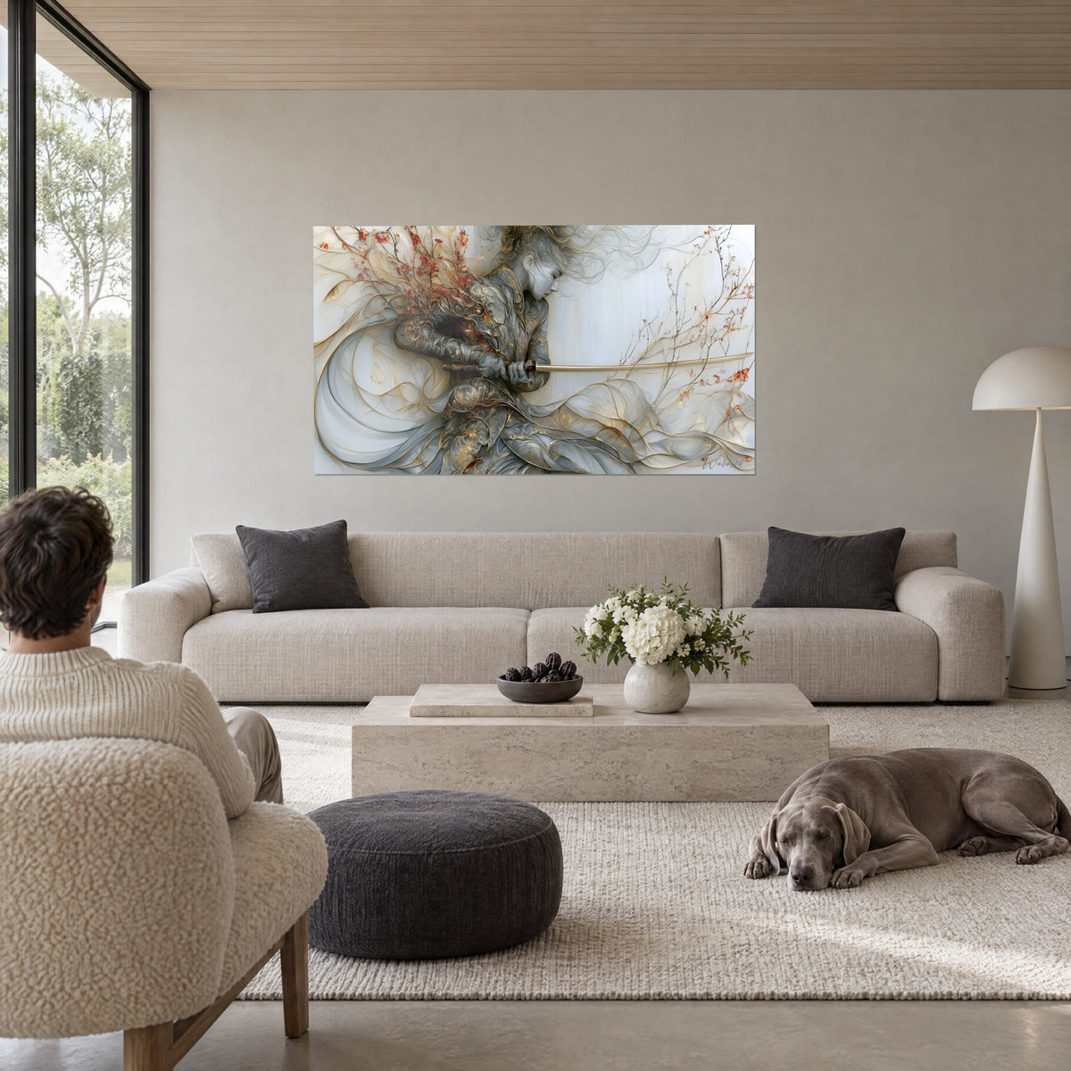 Wall art of a silver and gold warrior gripping her sabre, rust-coloured flowering branches, above a sofa in a bright living room