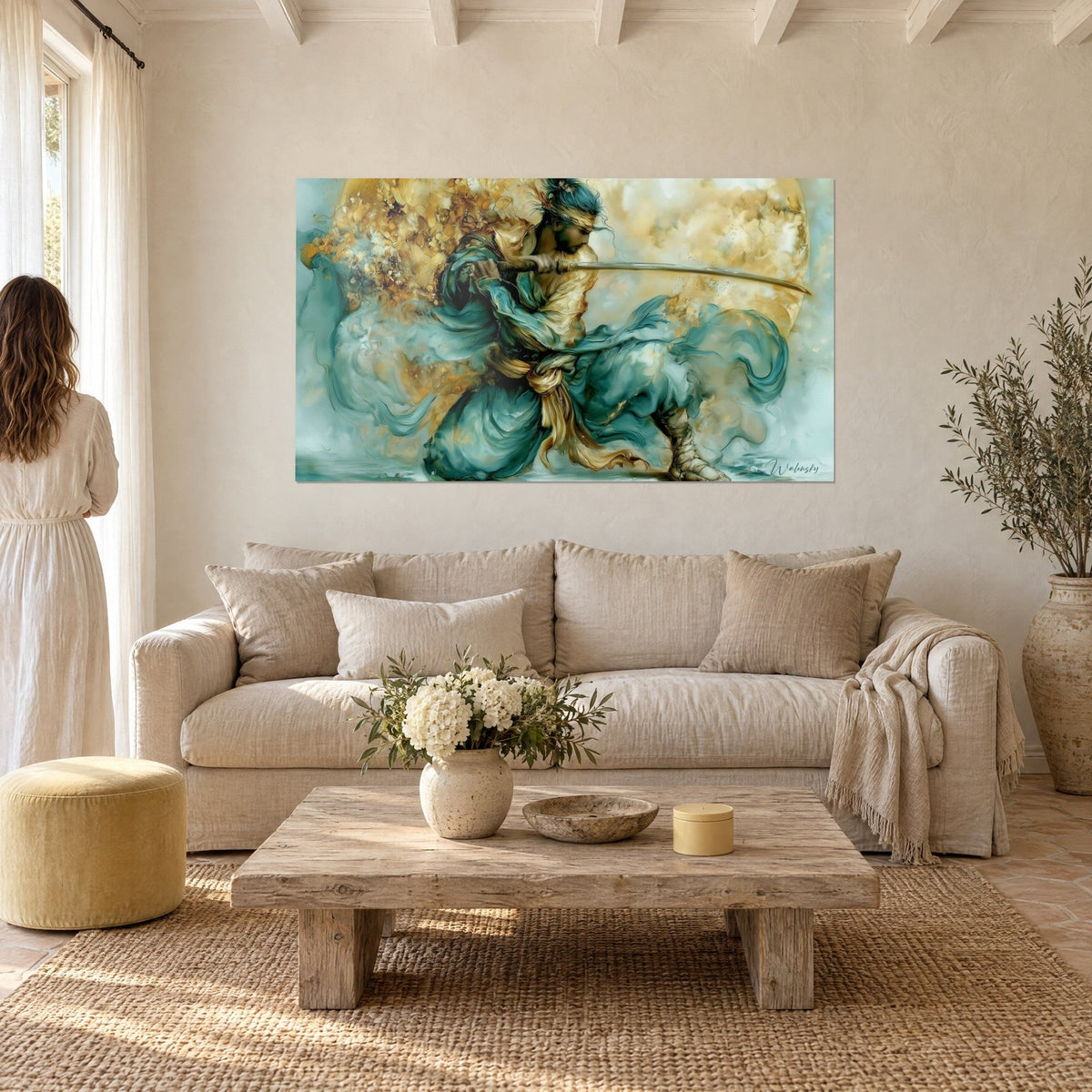 Wall art of a crouching samurai brandishing his katana, turquoise and gold silk, two people seen from behind, above a sofa in a bright living room