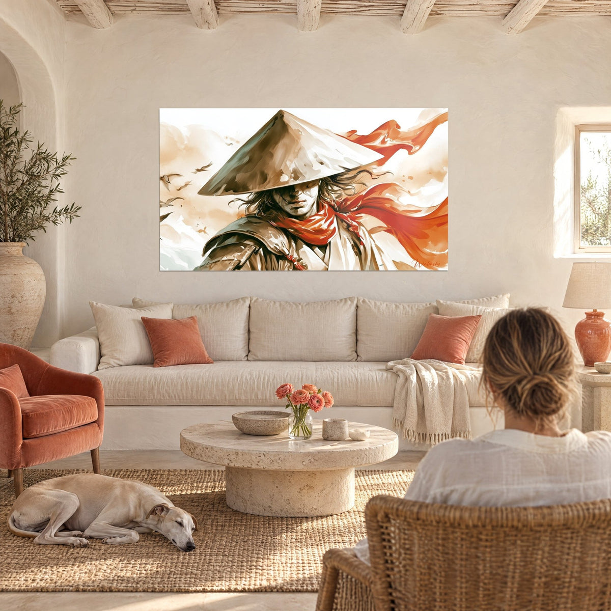 Wall art of a warrior in a beige and russet conical hat, red scarf billowing, above a sofa in a bright living room