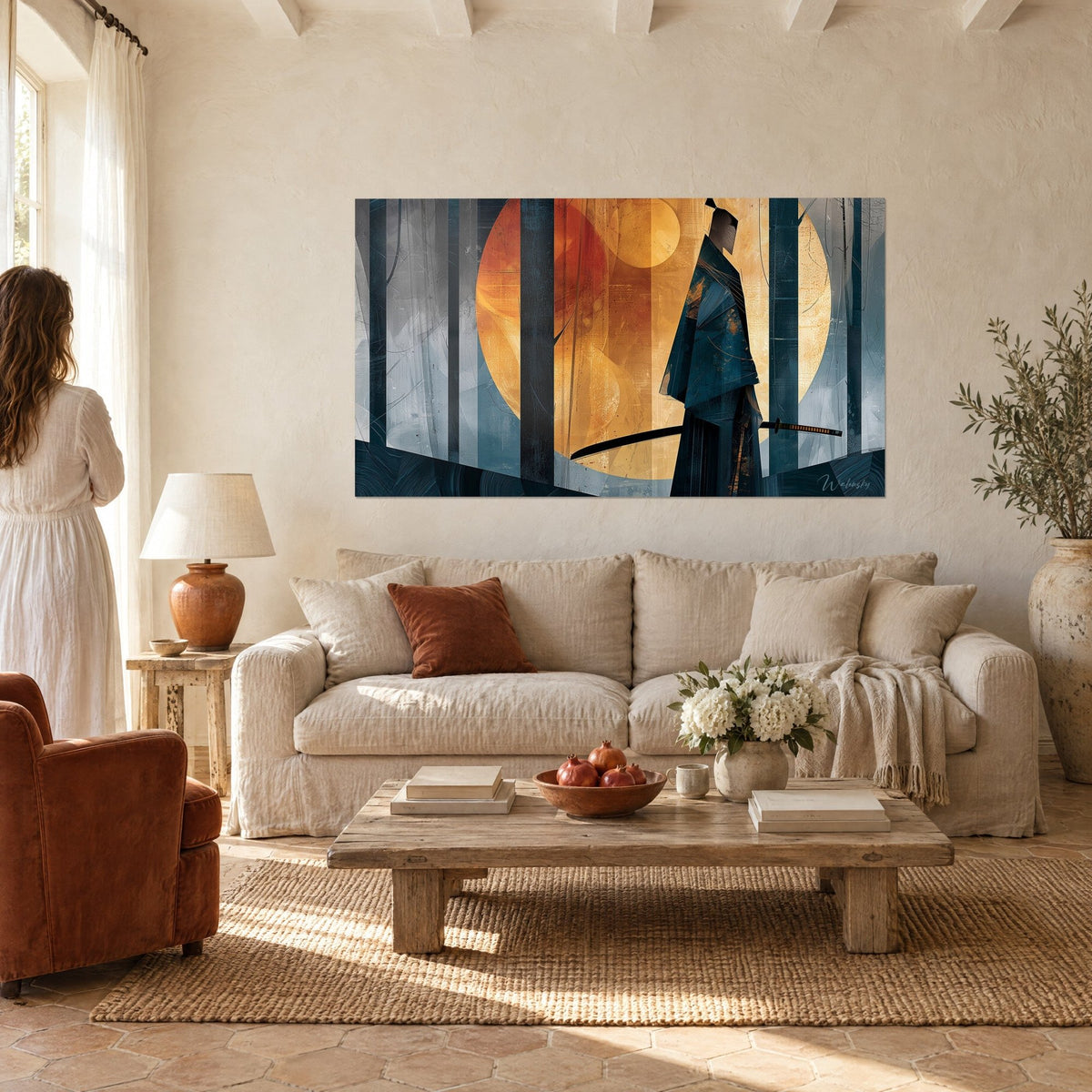 Wall art warrior in a midnight blue kimono before an amber moon, black katana and dark tree trunks, hung above a sofa in a bright living room