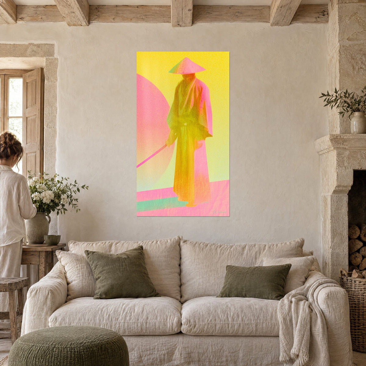 Wall art samurai in a lemon-yellow conical hat, pastel pink disc and pink sword, above a sofa in a bright living room