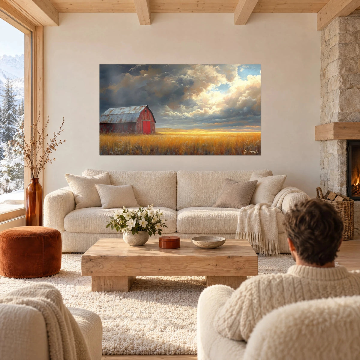 Quadro di un fienile rosso arrugginito sotto nuvole di tempesta, campo di grano dorato, sopra un divano in un soggiorno luminoso