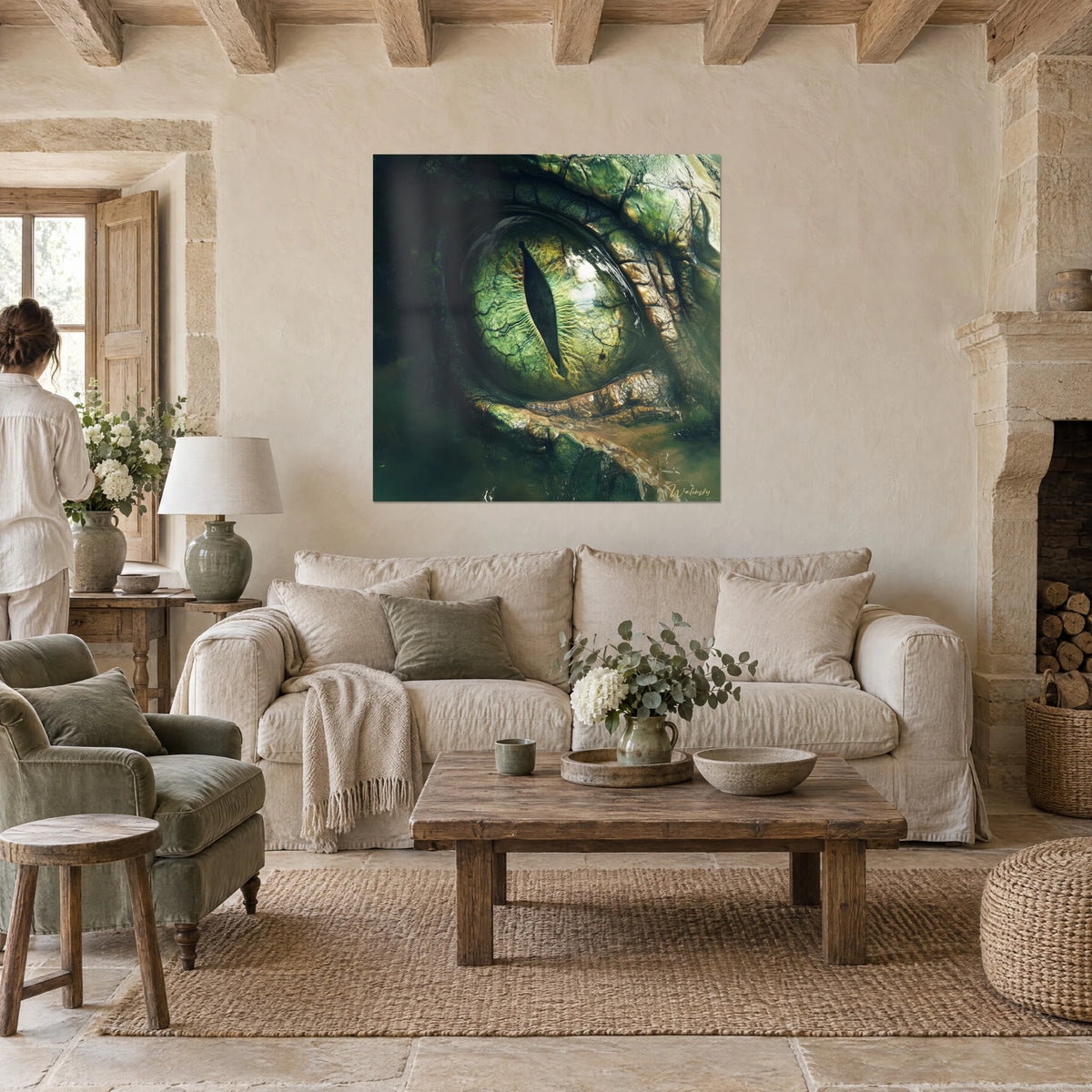 Wall art olive green reptile eye with slit pupil and golden scales, a woman seen from behind, above a sofa in a bright living room