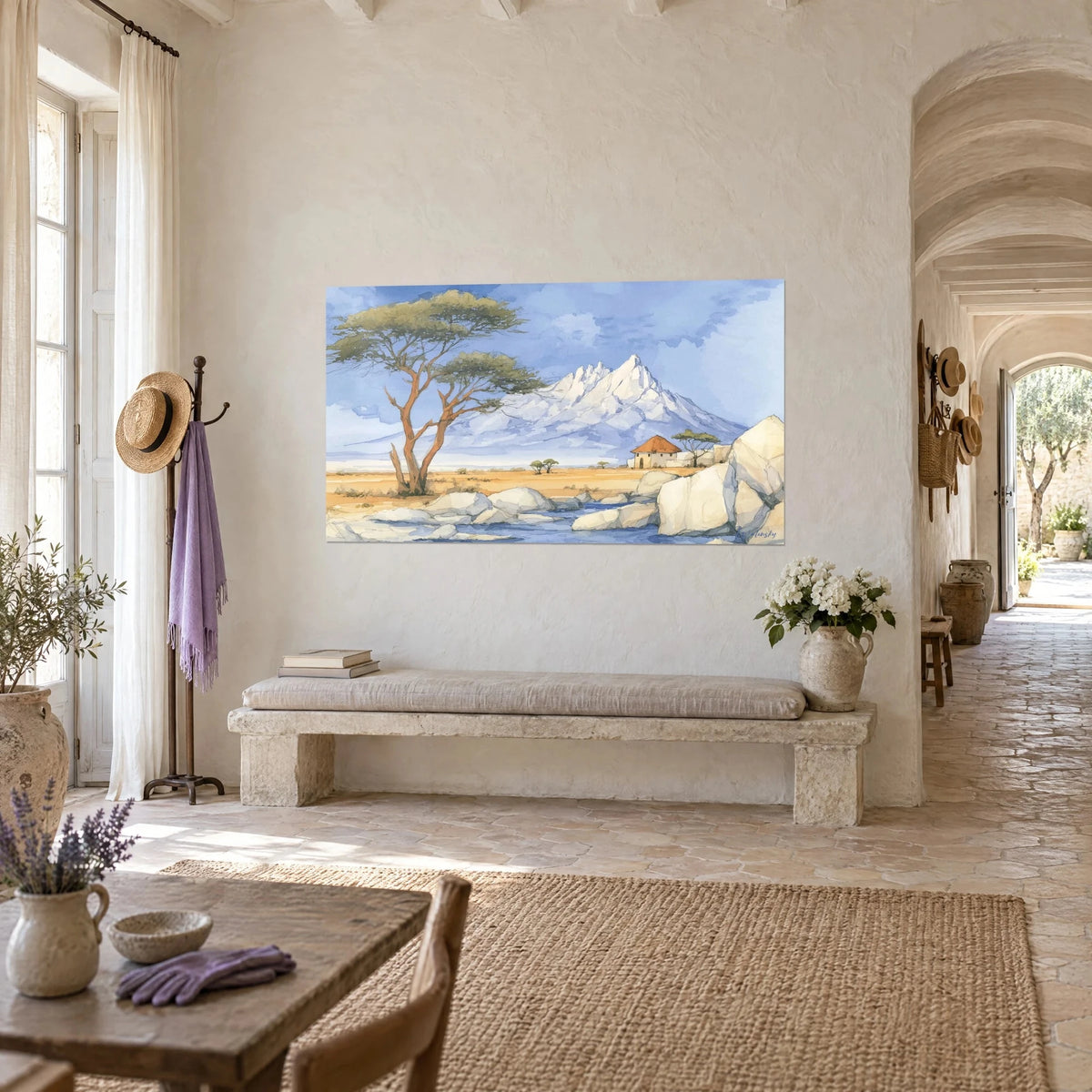 Wall art white peak of Mount Kilimanjaro in watercolor, periwinkle blue sky, golden grasses and pale rocks, on a wall of the Provençal farmhouse
