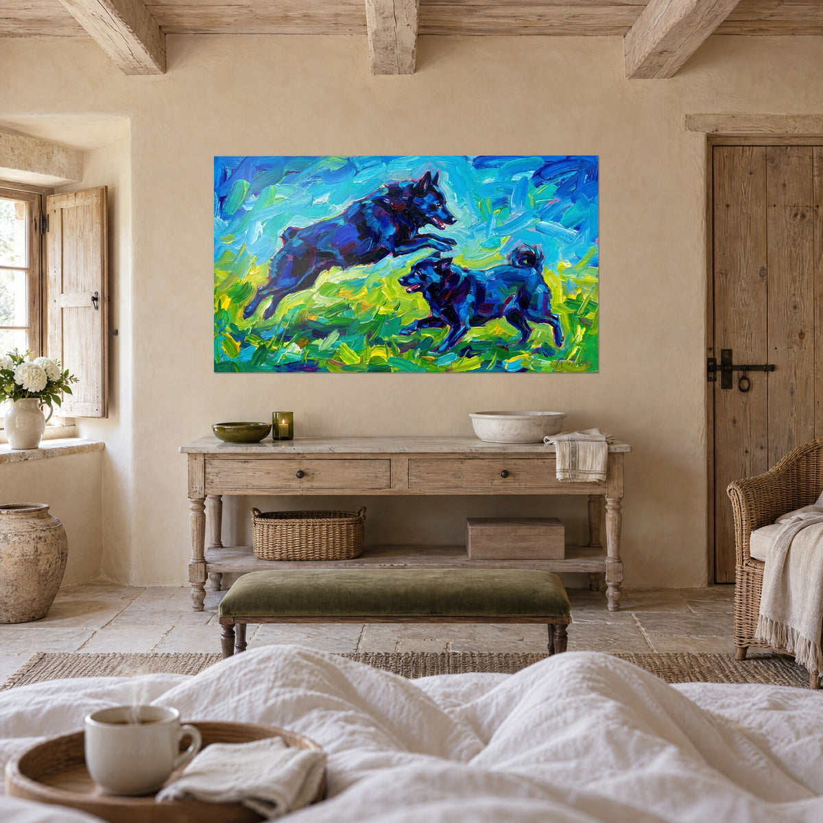 Wall art of a pair of black dogs playing, turquoise and lemon-yellow impasto strokes, above a bed in a light bedroom