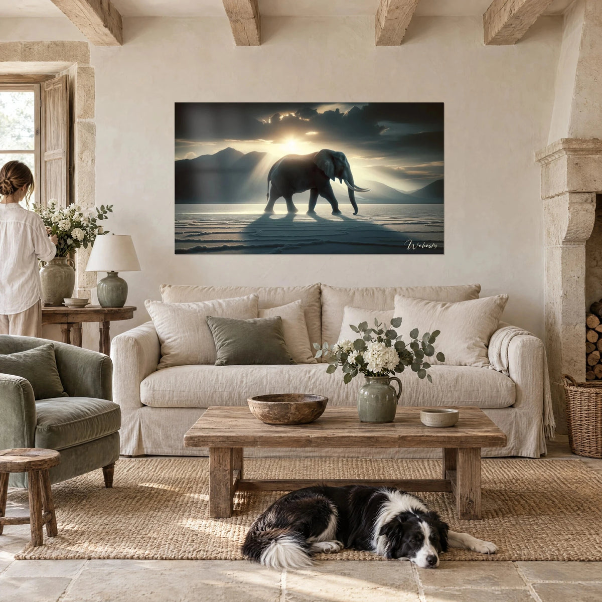 Wall art Lone elephant in backlight, ivory tusks and grey cloudy sky, in a living room above a sofa in a bright lounge