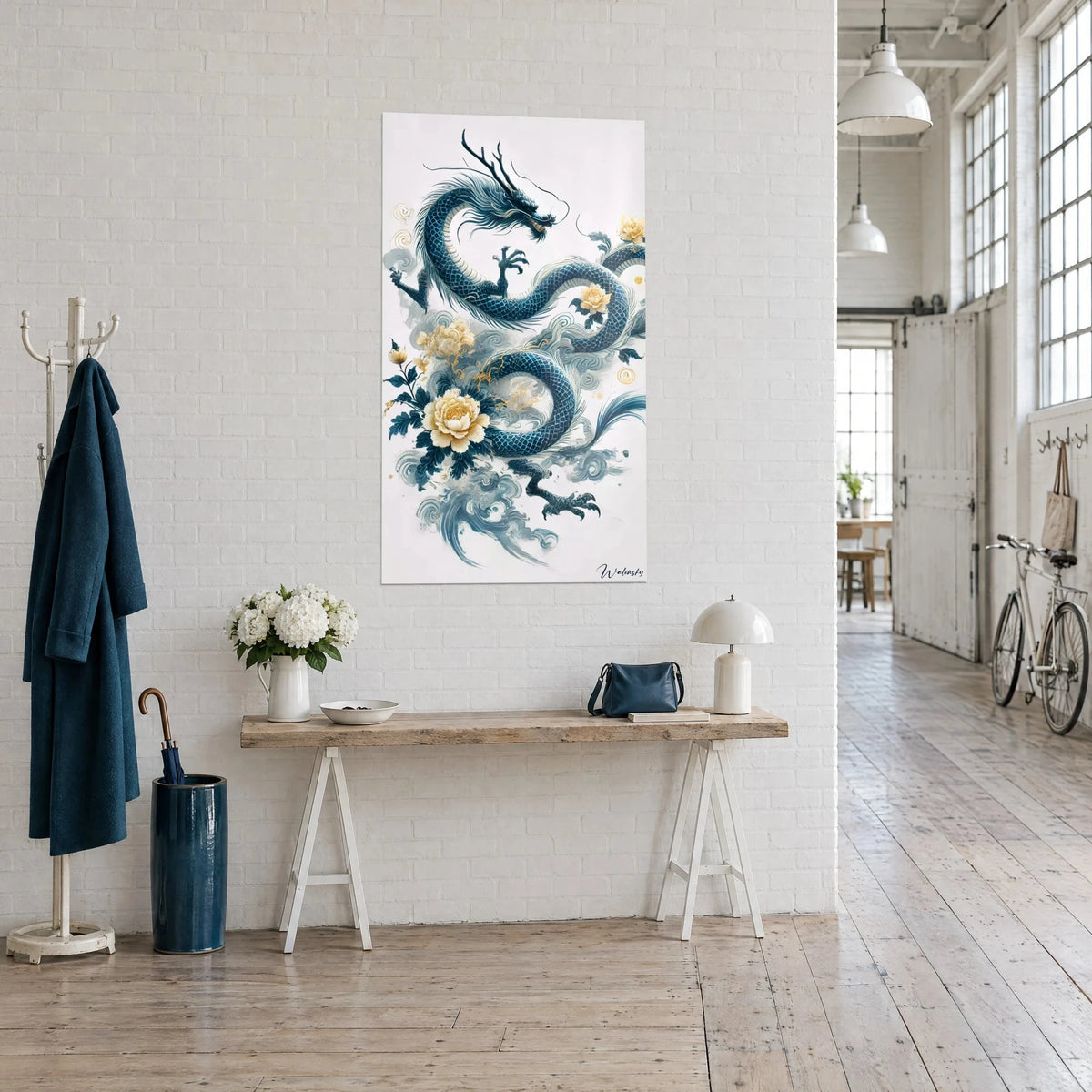 Wall art of a celestial serpent with petrol-blue scales and pale yellow peonies, three-quarter view in an artist's loft
