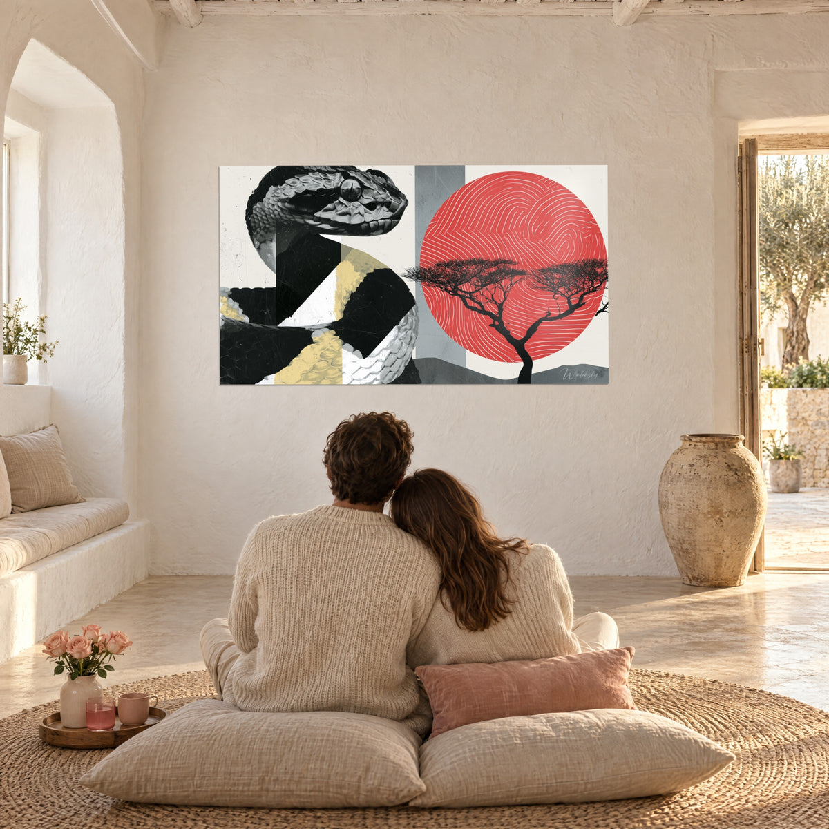 Wall art of a coiled black and ivory snake, red disc in a spiral, black African tree, white stone and linen living room