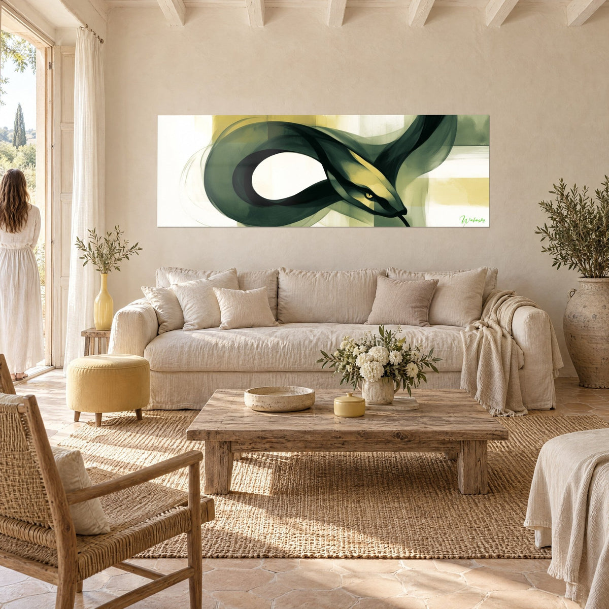 Wall art black and gold snake coiling in a loop, ivory background, young woman seen from behind, above a sofa in a bright living room