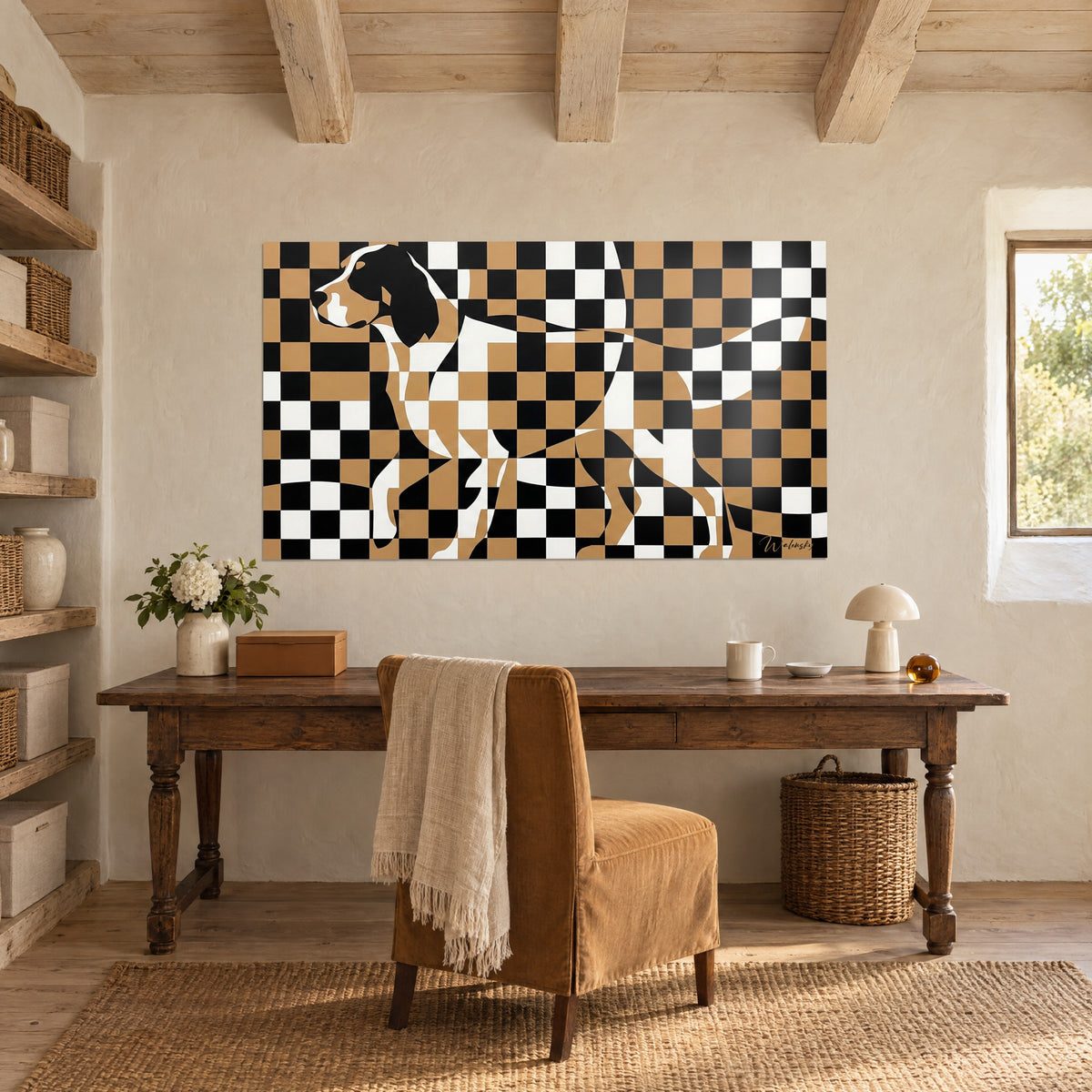 Wall art dog silhouette in ochre, black and white checkerboard, hung above an antique wooden desk and a beige chair