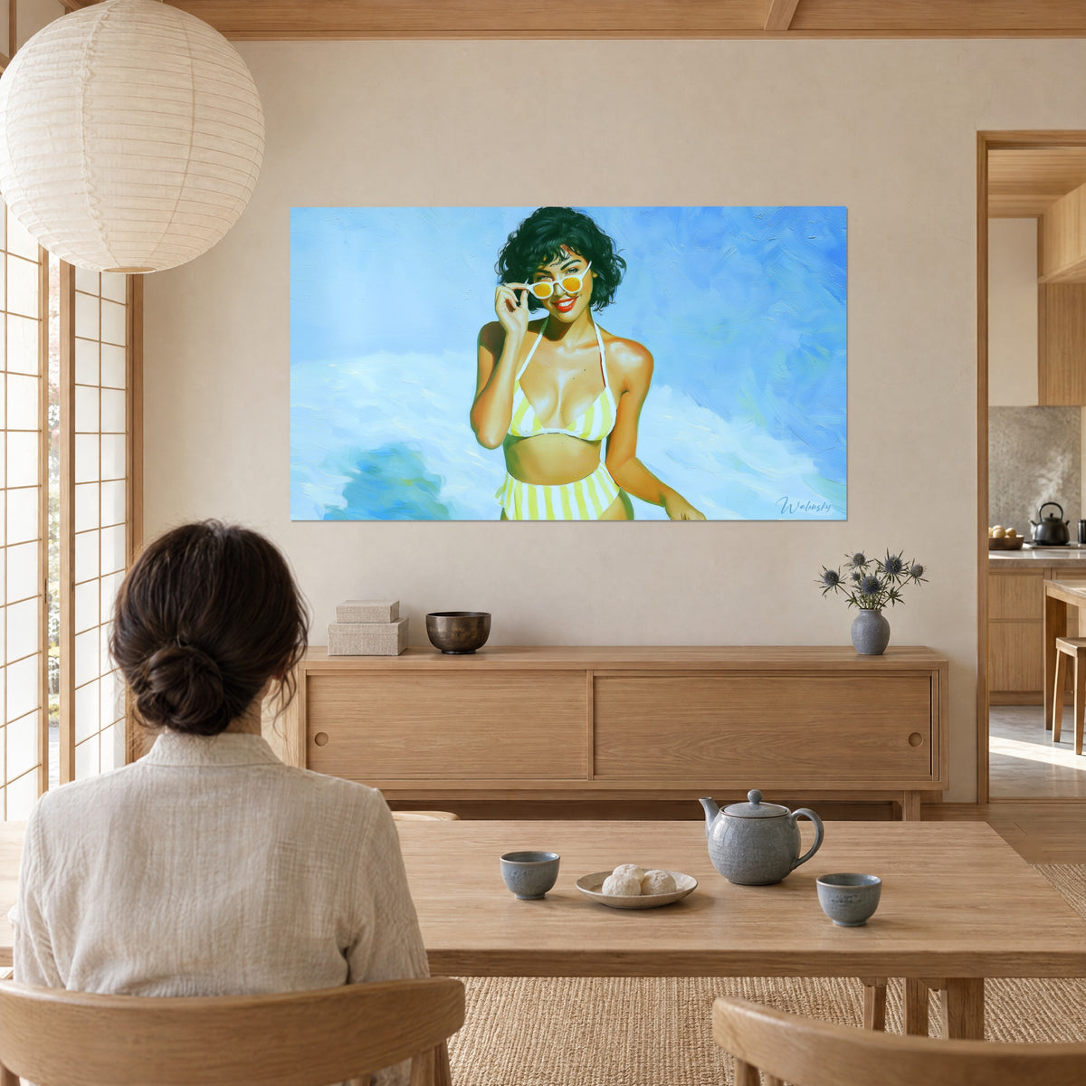 Wall art smiling brunette in a lemon and white striped swimsuit, turquoise blue waves, viewed by a woman from behind, Japandi living room