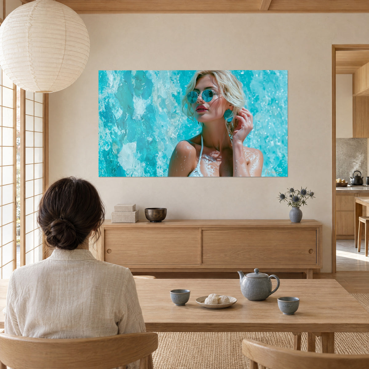 Wall art sun-kissed face of a wet blonde, turquoise earring, white bikini, aqua water cascade, two people seen from behind in front of the cream wall