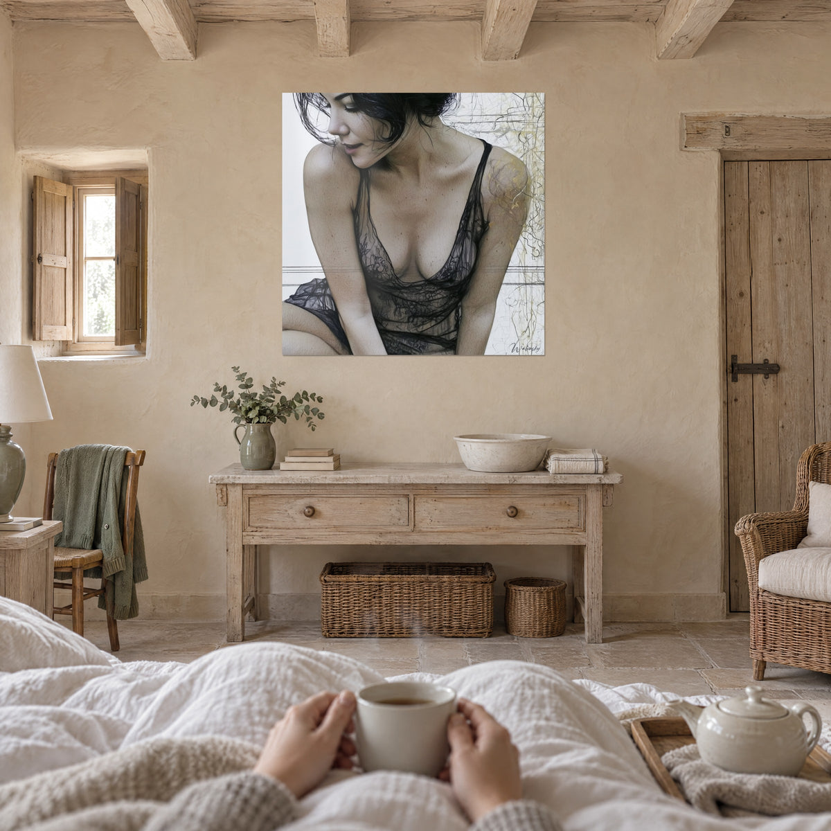 Wall art of a pensive brunette in black tulle lingerie, amber skin and white background veined with gold, above a bed in a bright bedroom