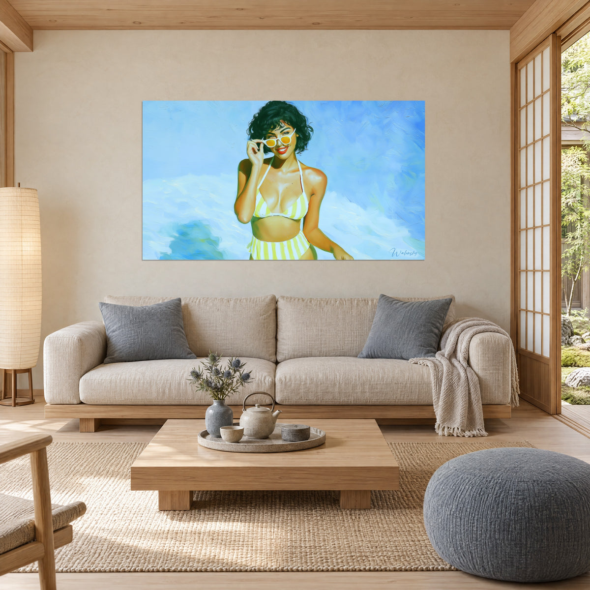 Wall art young woman with round yellow glasses, white and yellow striped bikini, blue sky, above a sofa in a bright living room