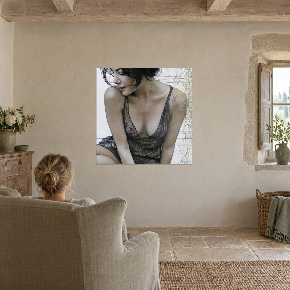 Wall art of a smiling young brunette in a sheer black nightgown, fine gold lines on off-white background, facing a woman in an armchair