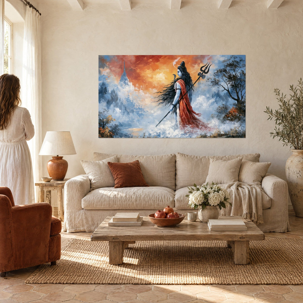 Wall art of blue-skinned Shiva, red drape and trident, blazing orange sky, above a sofa in a bright living room