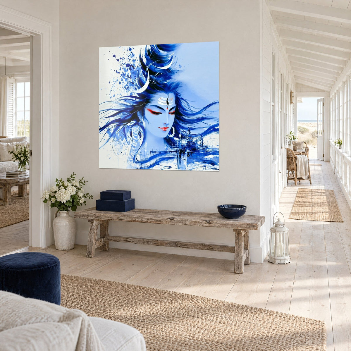 Wall art blue deity with long floating hair and white crescent moon, miniature city at the bottom, hallway of a coastal home
