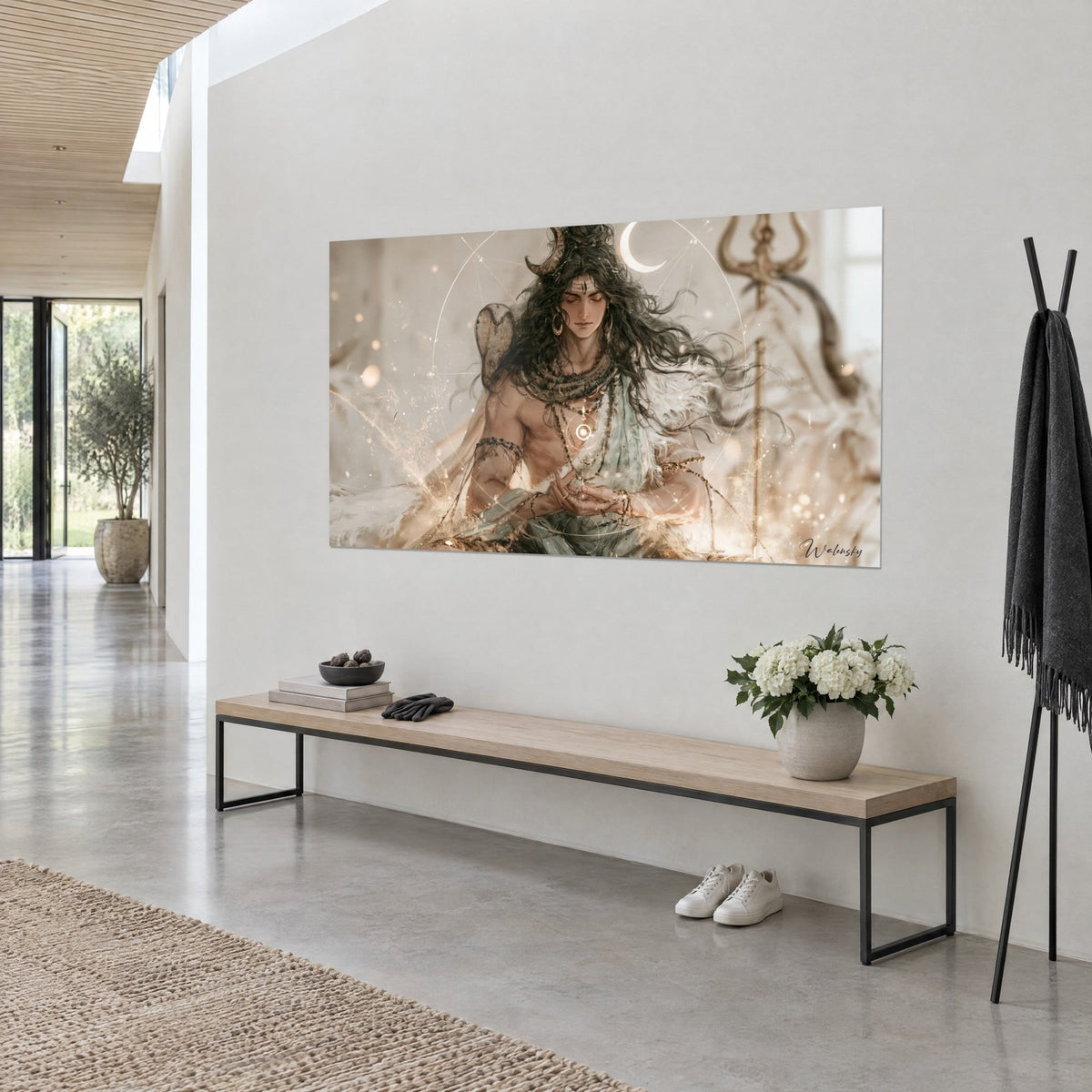 Wall art Hindu deity with closed eyes, white glowing halo and brown beads, hung on a beige wall above a wooden bench
