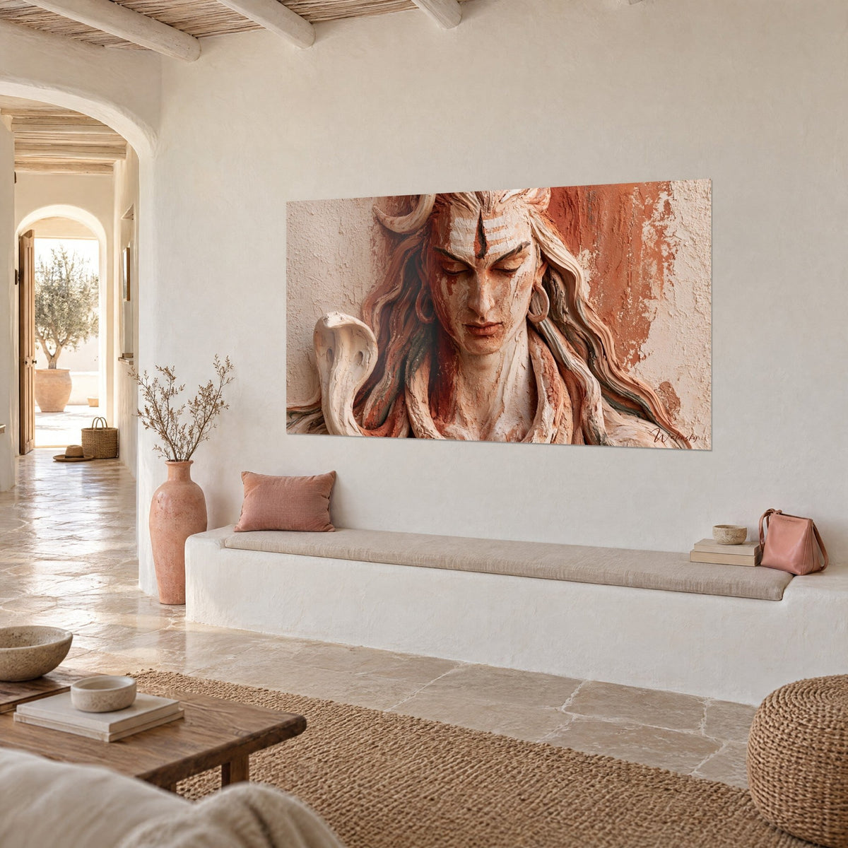 Wall art Hindu deity with closed eyelids, gold earrings, ochre and beige walls, white banquette, Mediterranean house