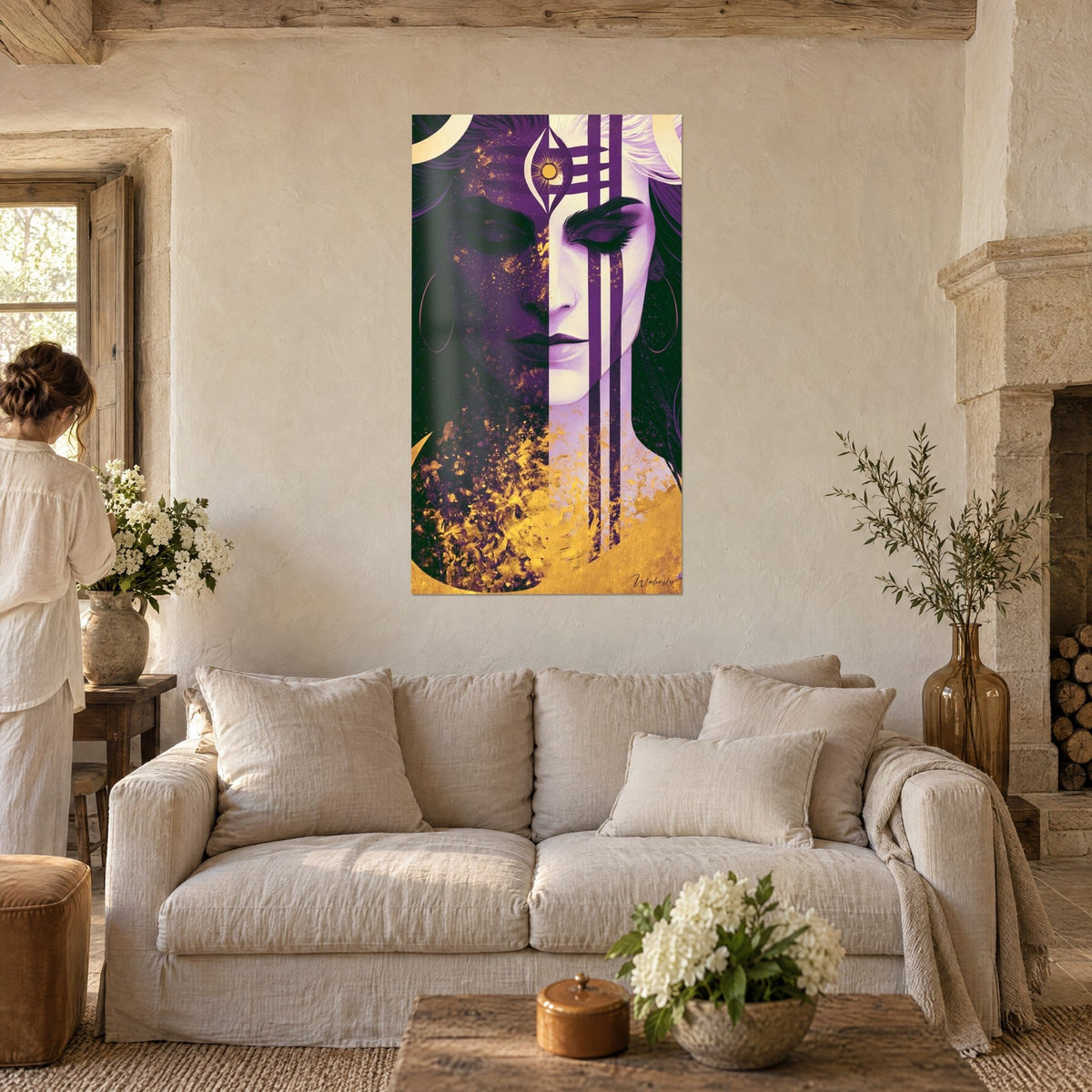 Wall art goddess face in half violet and half lilac, golden eye on the forehead, gold splashes, woman seen from behind, above a sofa in a bright living room