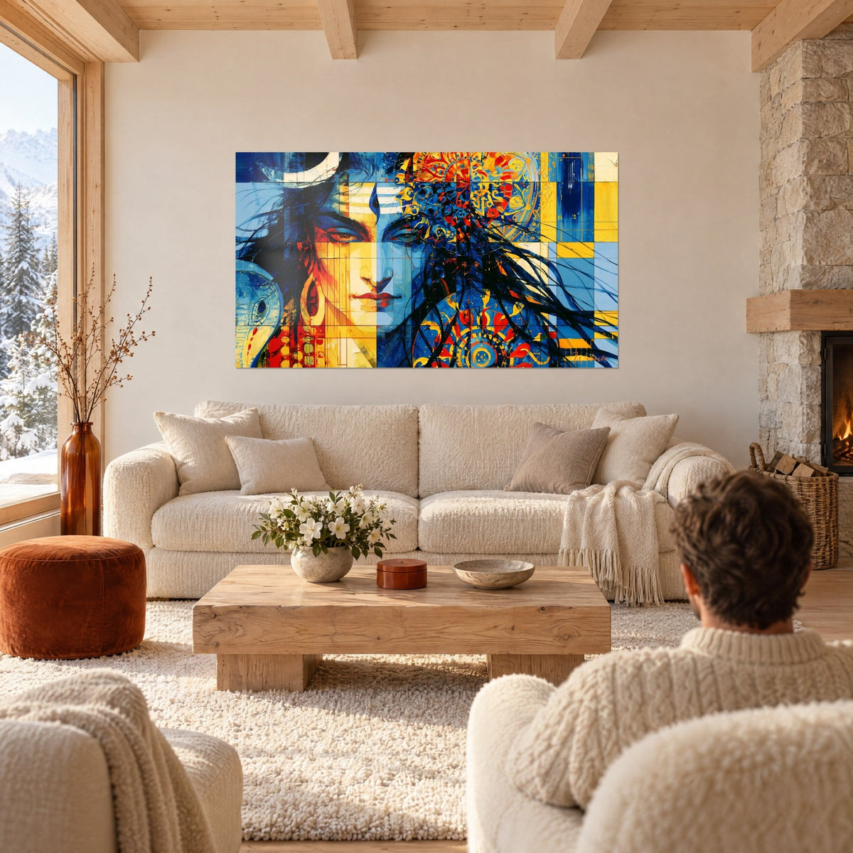 Wall art Shiva face half blue half yellow, white crescent moon, couple seen from behind above a sofa in a bright living room