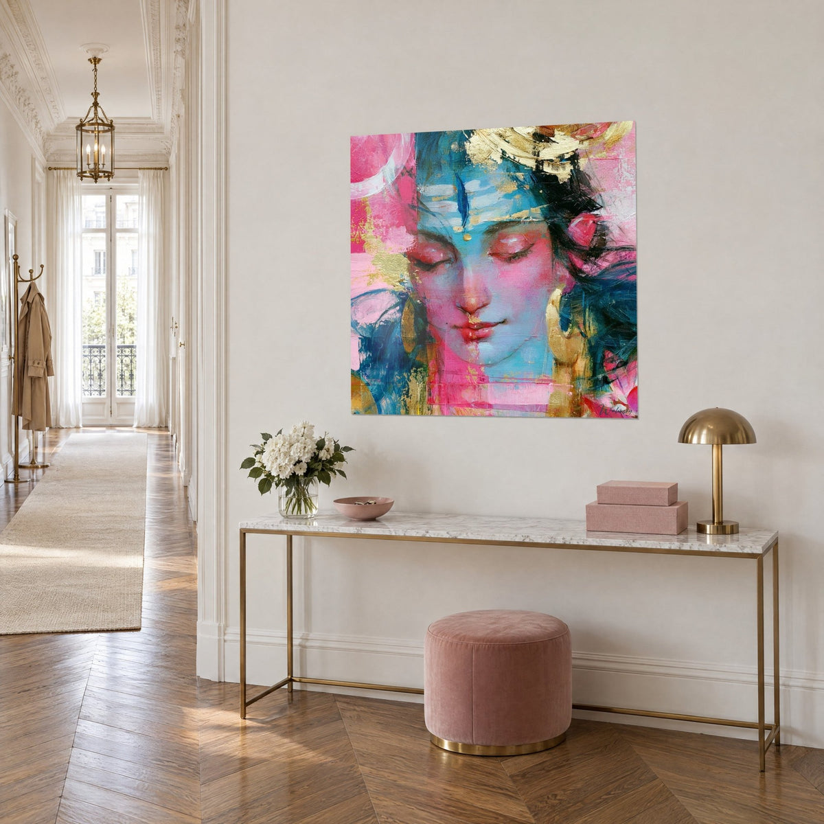 Wall art sleeping deity with carmine lips, turquoise skin and gold touches, on a beige wall above a marble console
