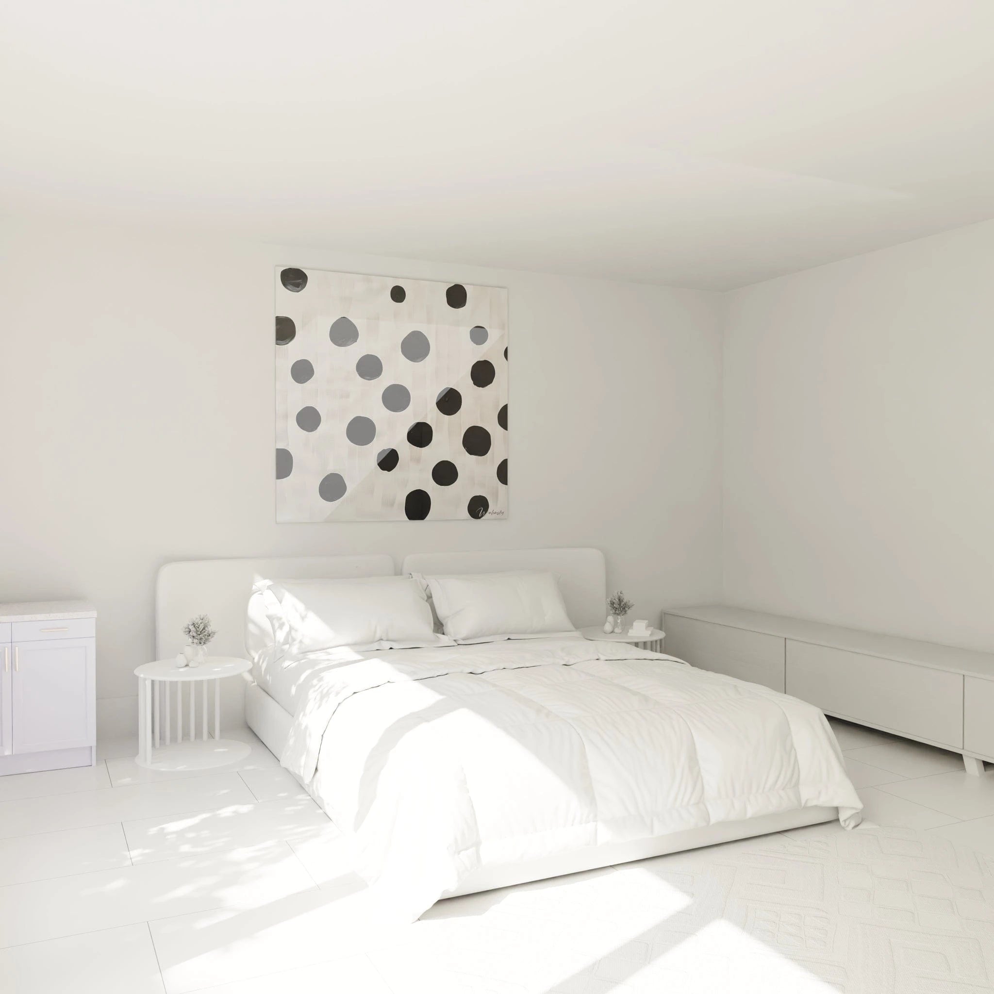 Tableau tacheté noir et blanc de Walensky accroché au mur dans une chambre lumineuse